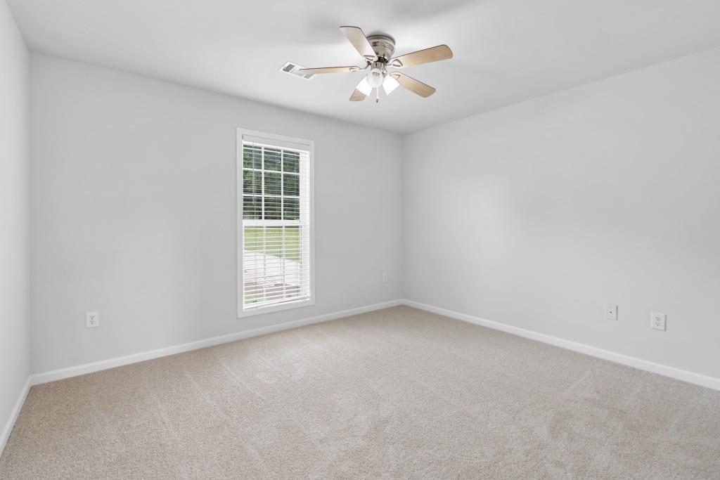 1214 Roxey Maxey Road Southwest Winder, GA 30680 - Photo 16 of 35 a view of an empty room with a window