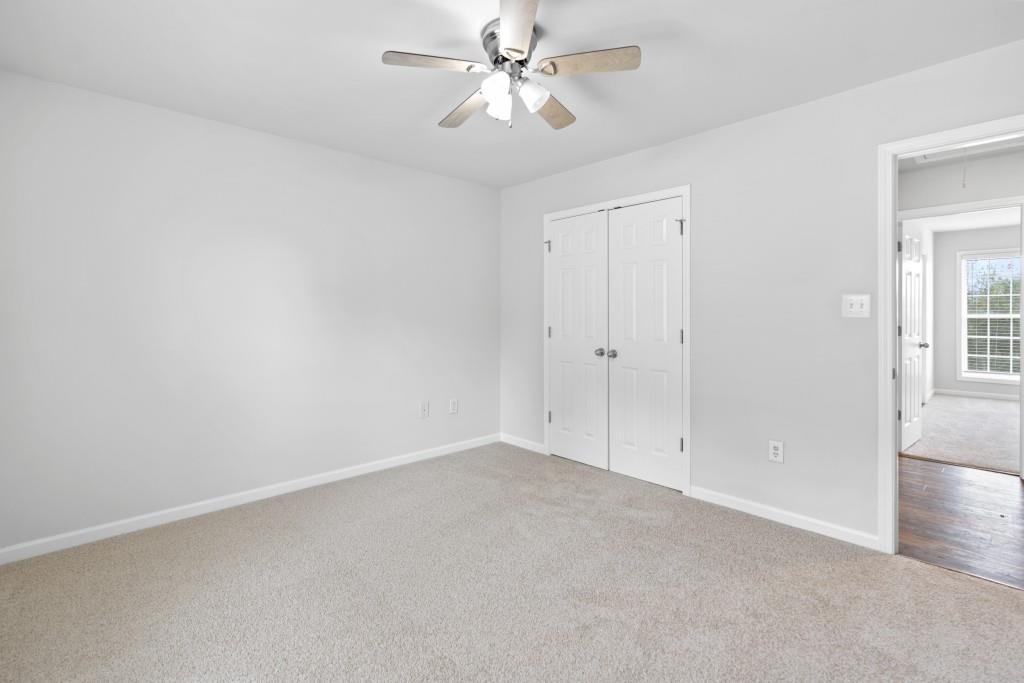 1214 Roxey Maxey Road Southwest Winder, GA 30680 - Photo 17 of 35 a view of an empty room