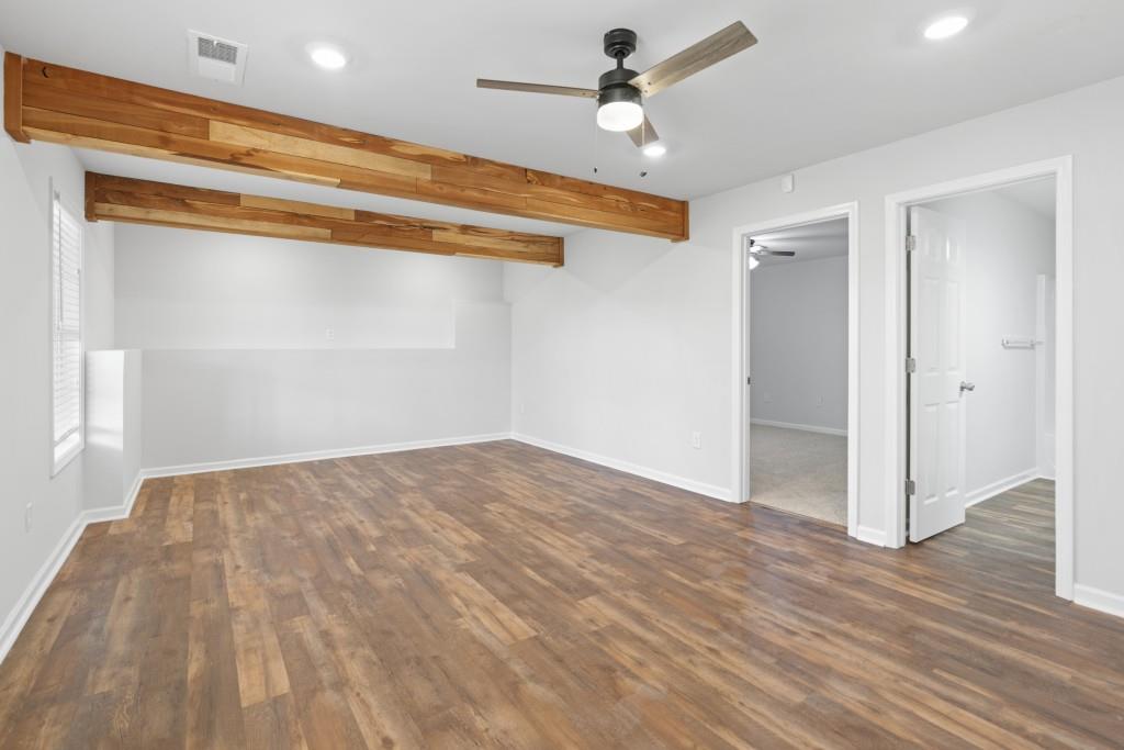 1214 Roxey Maxey Road Southwest Winder, GA 30680 - Photo 25 of 35 a view of empty room with wooden floor