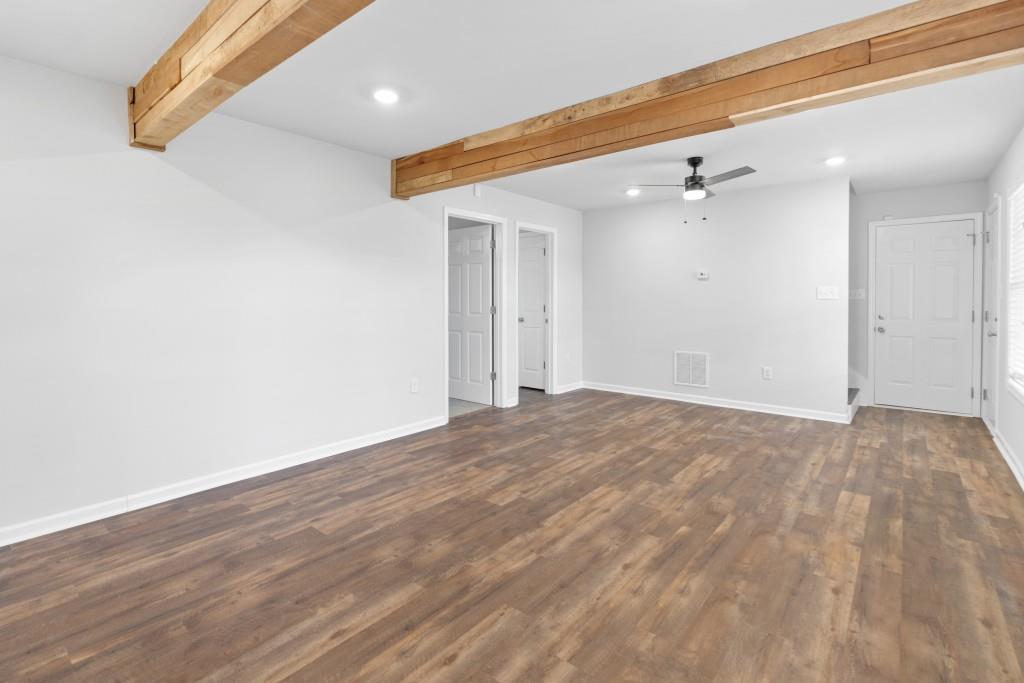 1214 Roxey Maxey Road Southwest Winder, GA 30680 - Photo 26 of 35 a view of empty room with wooden floor