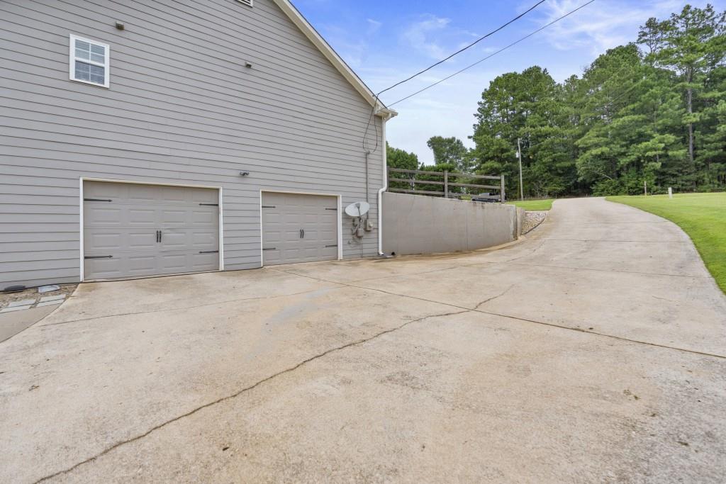 1214 Roxey Maxey Road Southwest Winder, GA 30680 - Photo 32 of 35 a view of a garage