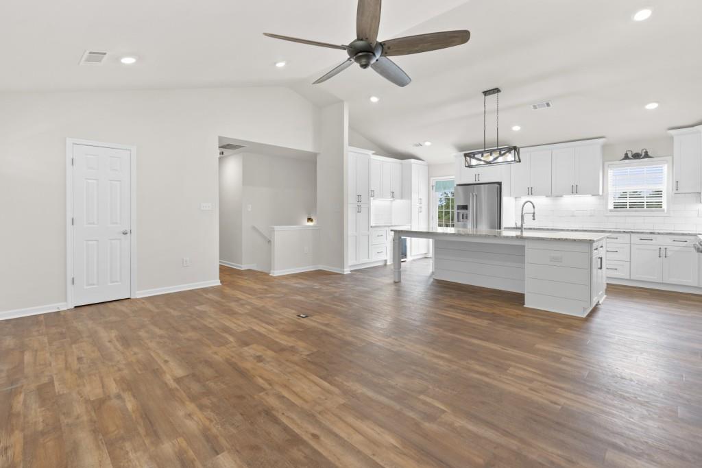 1214 Roxey Maxey Road Southwest Winder, GA 30680 - Photo 5 of 35 a view of kitchen and hall with wooden floor