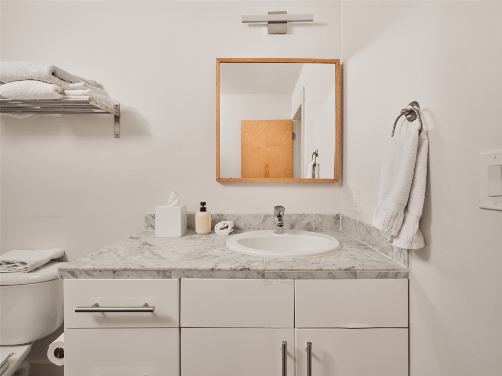 2002 East 13th Street, Unit A Austin, TX 78702 - Photo 29 of 37 Bathroom featuring vanity and toilet