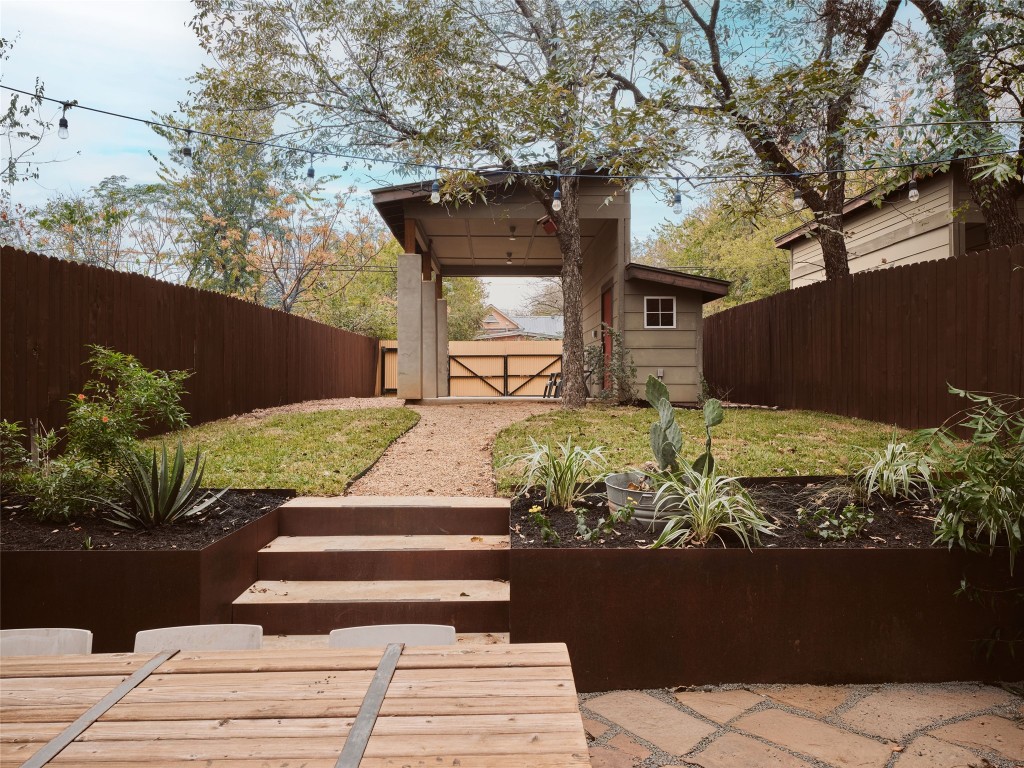 2002 East 13th Street, Unit A Austin, TX 78702 - Photo 7 of 37 Fenced backyard featuring an outdoor structure