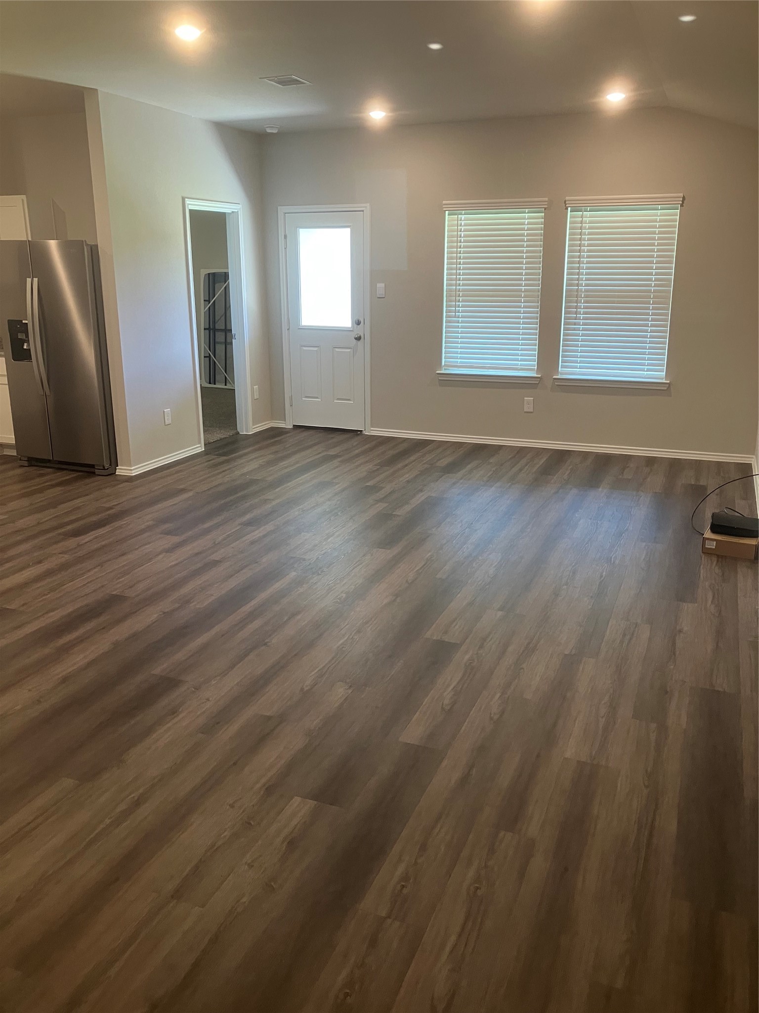 232 Blanco Drive Huntsville, TX 77340 - Photo 13 of 15 an empty room with wooden floor and windows