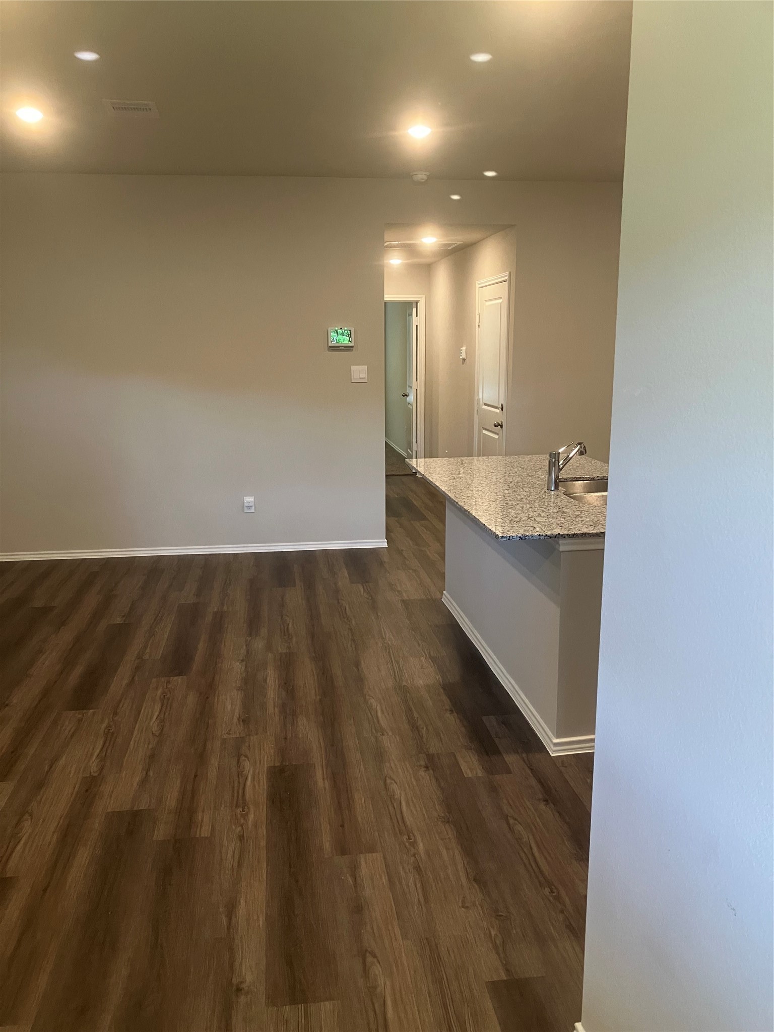 232 Blanco Drive Huntsville, TX 77340 - Photo 5 of 15 a view of a room with wooden floor and a sink