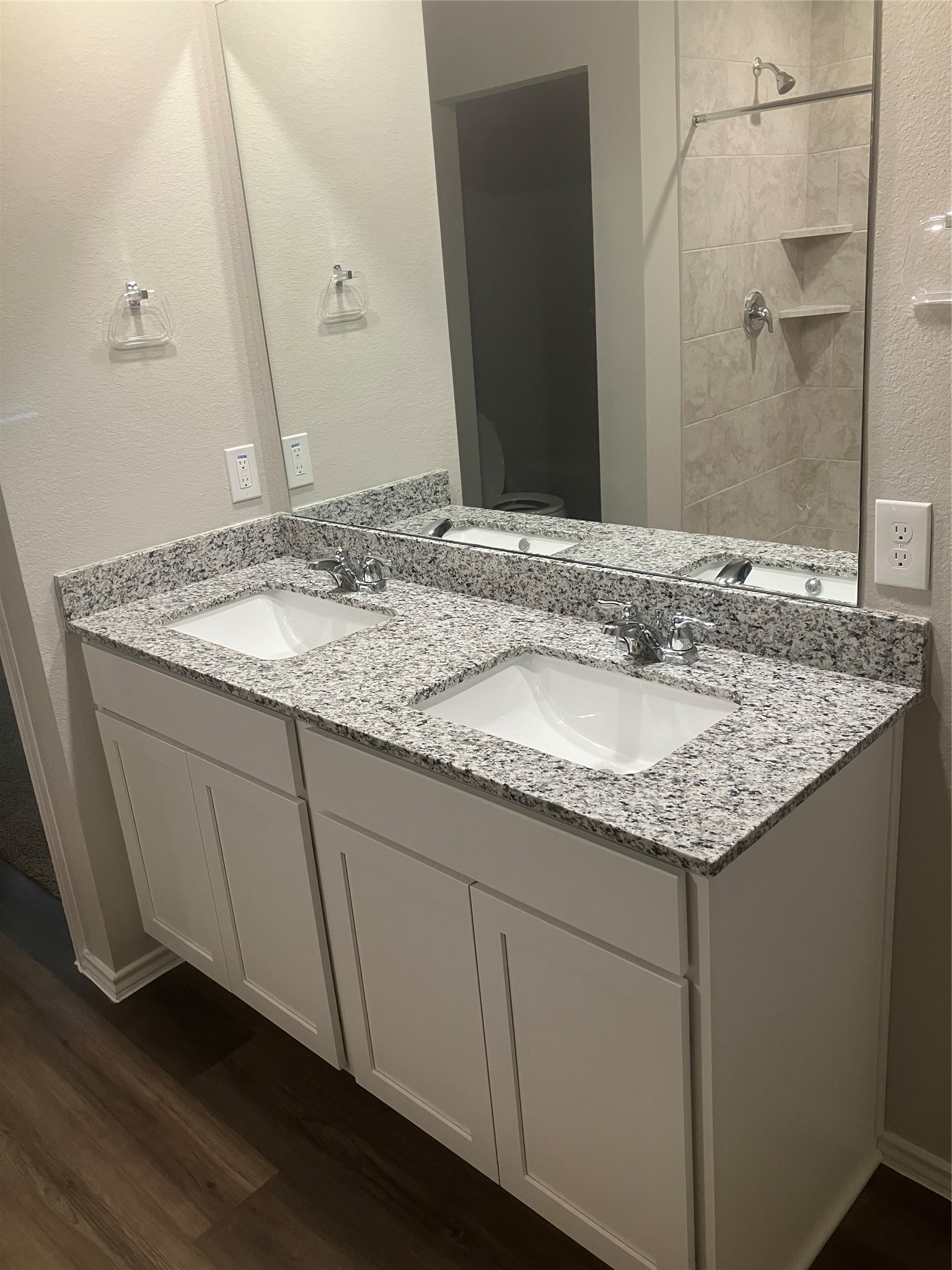 232 Blanco Drive Huntsville, TX 77340 - Photo 6 of 15 a bathroom with a granite countertop sink and a mirror