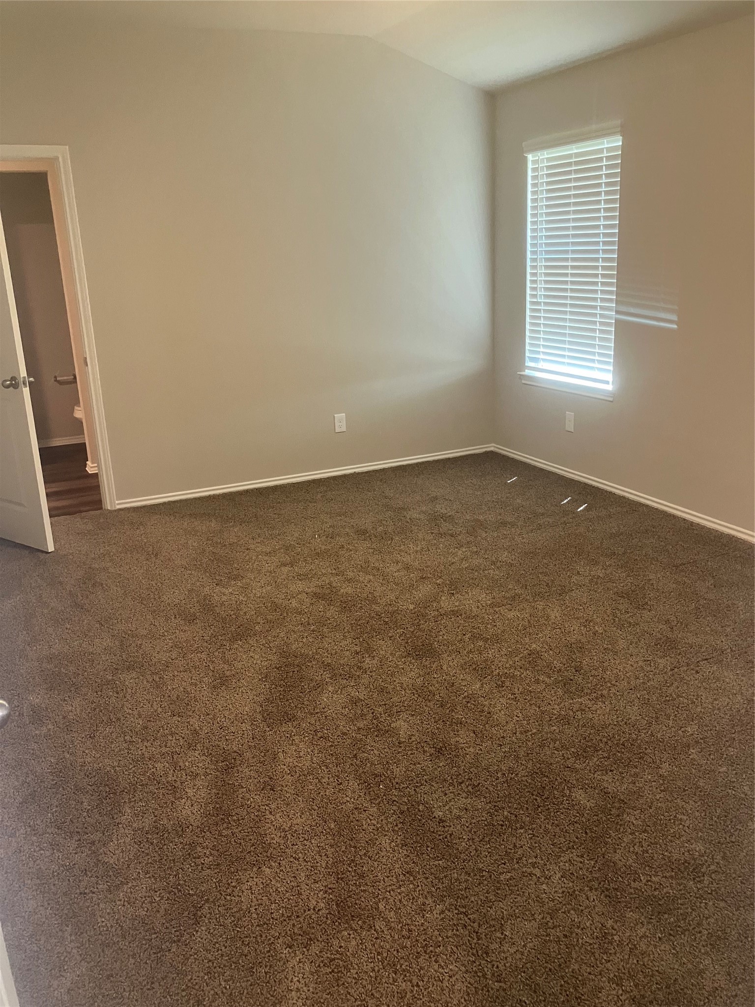 232 Blanco Drive Huntsville, TX 77340 - Photo 9 of 15 an empty room with a window