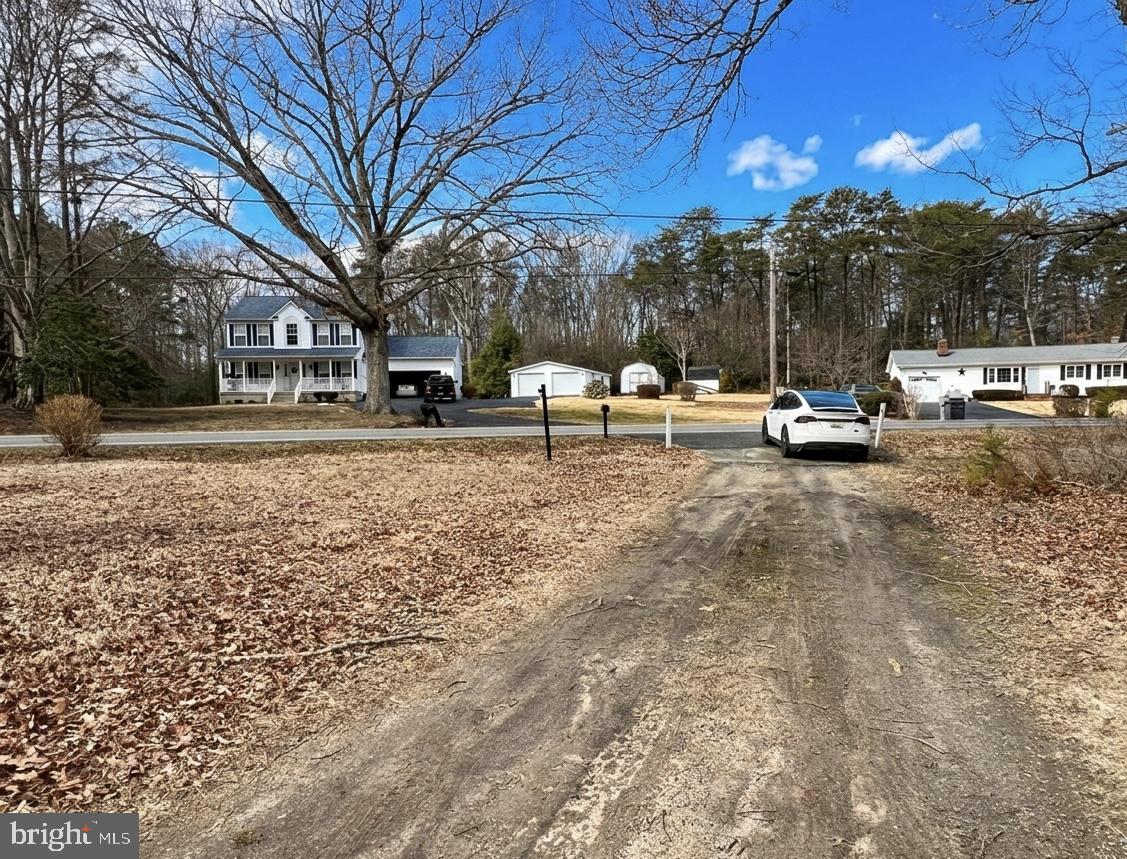 12156 Rousby Hall Road Lusby, MD 20657 - Photo 3 of 4 a view of a chairs and tables in the patio