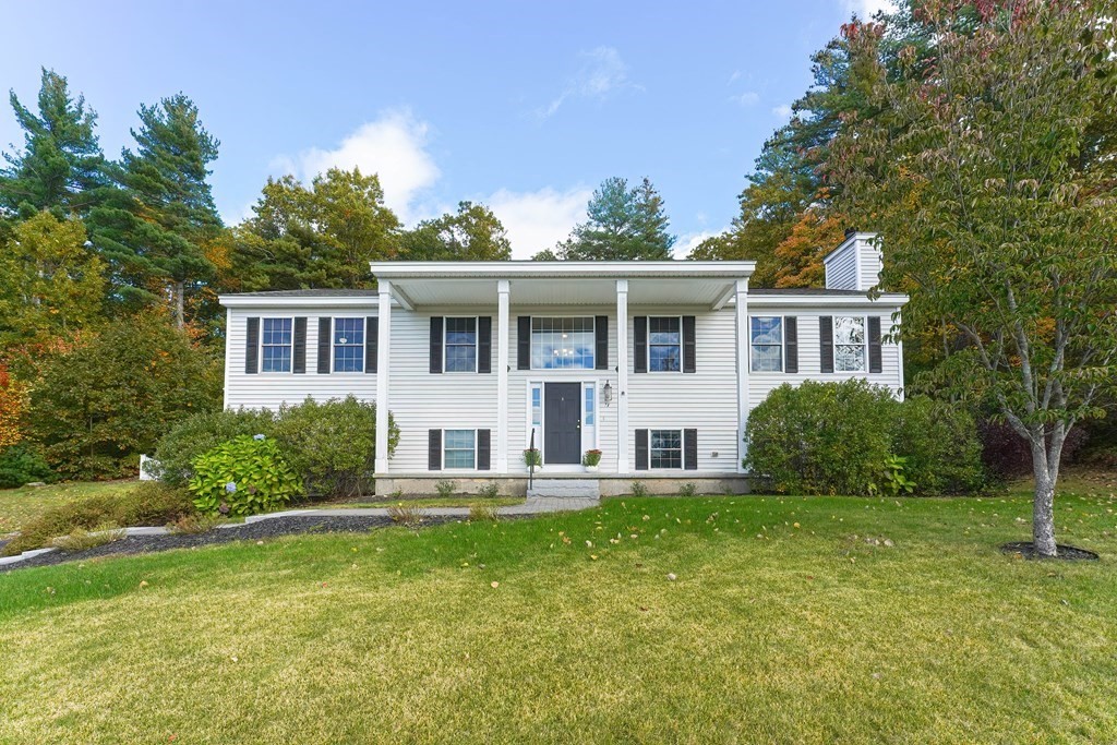 71 Snake Hill Road Ayer, MA 01432 - Photo 1 of 36 a front view of a house with a yard