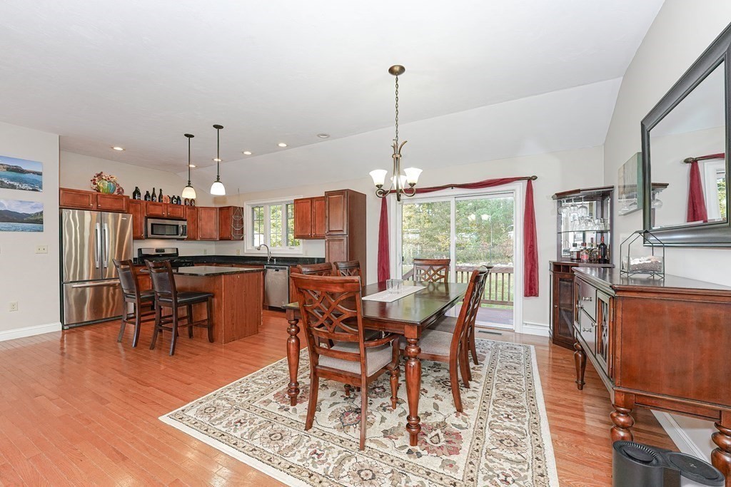 71 Snake Hill Road Ayer, MA 01432 - Photo 12 of 36 a view of a dining room with furniture window and wooden floor