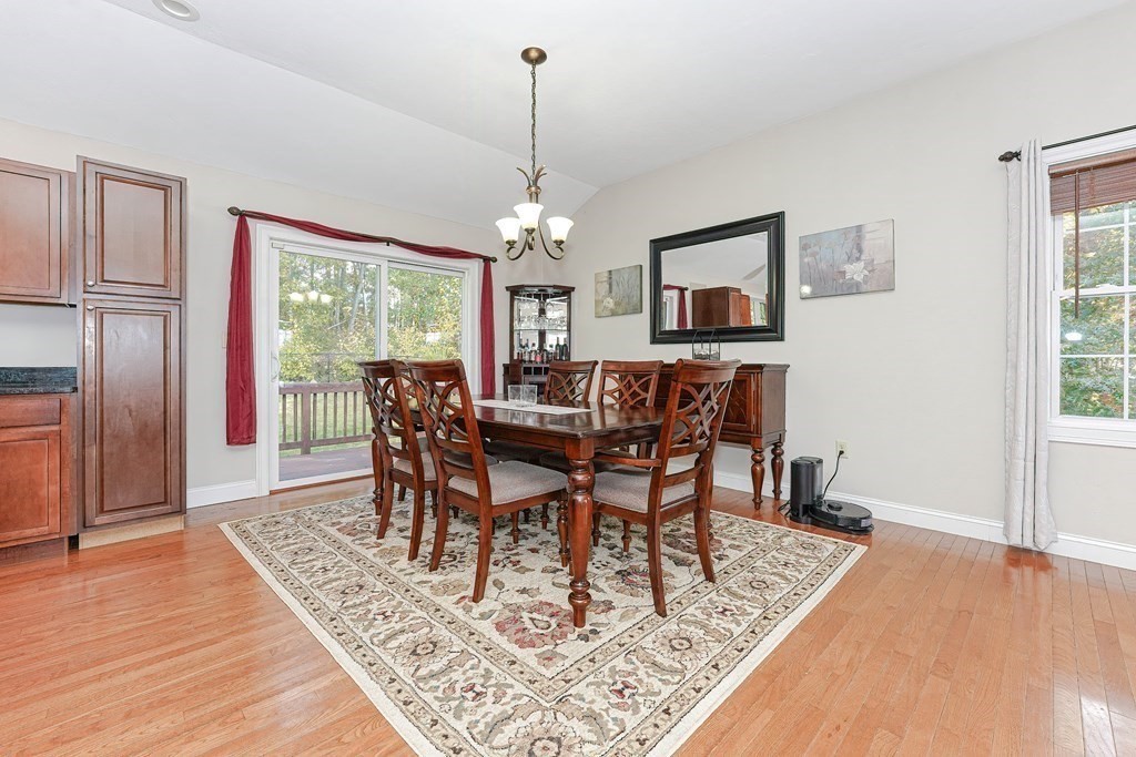 71 Snake Hill Road Ayer, MA 01432 - Photo 13 of 36 a view of a dining room with furniture window and wooden floor