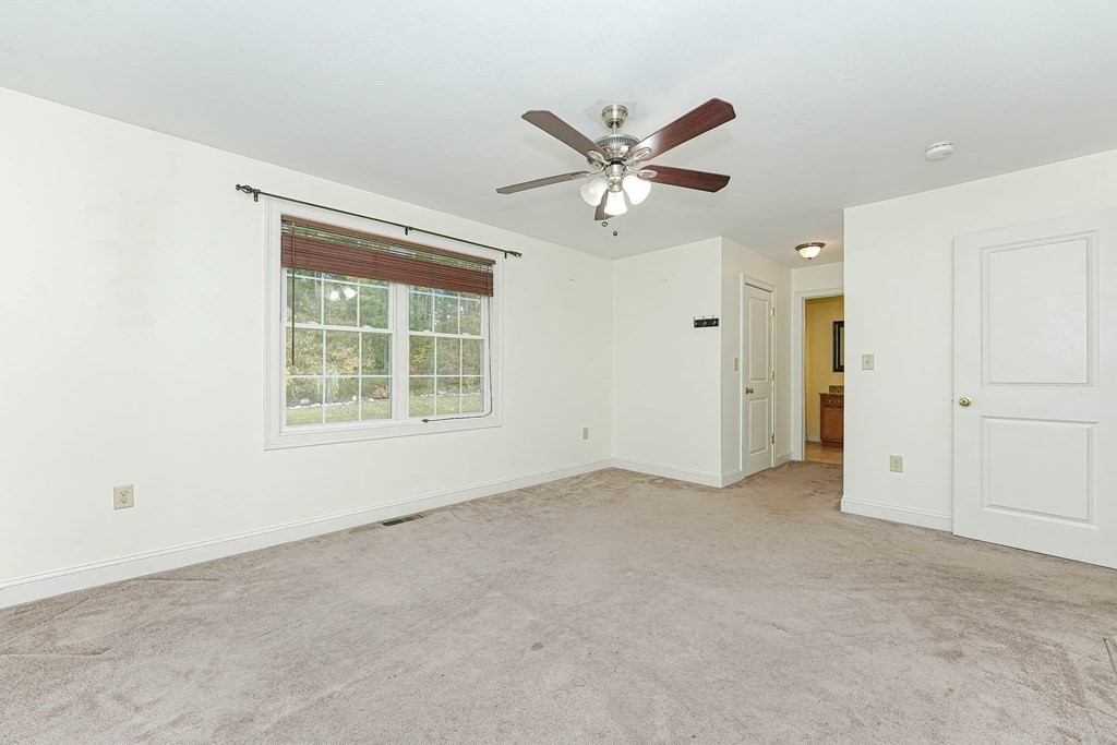 71 Snake Hill Road Ayer, MA 01432 - Photo 16 of 36 a view of an empty room with a window