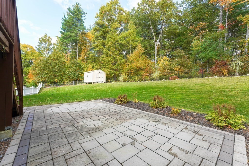 71 Snake Hill Road Ayer, MA 01432 - Photo 20 of 36 a view of a garden with a bench