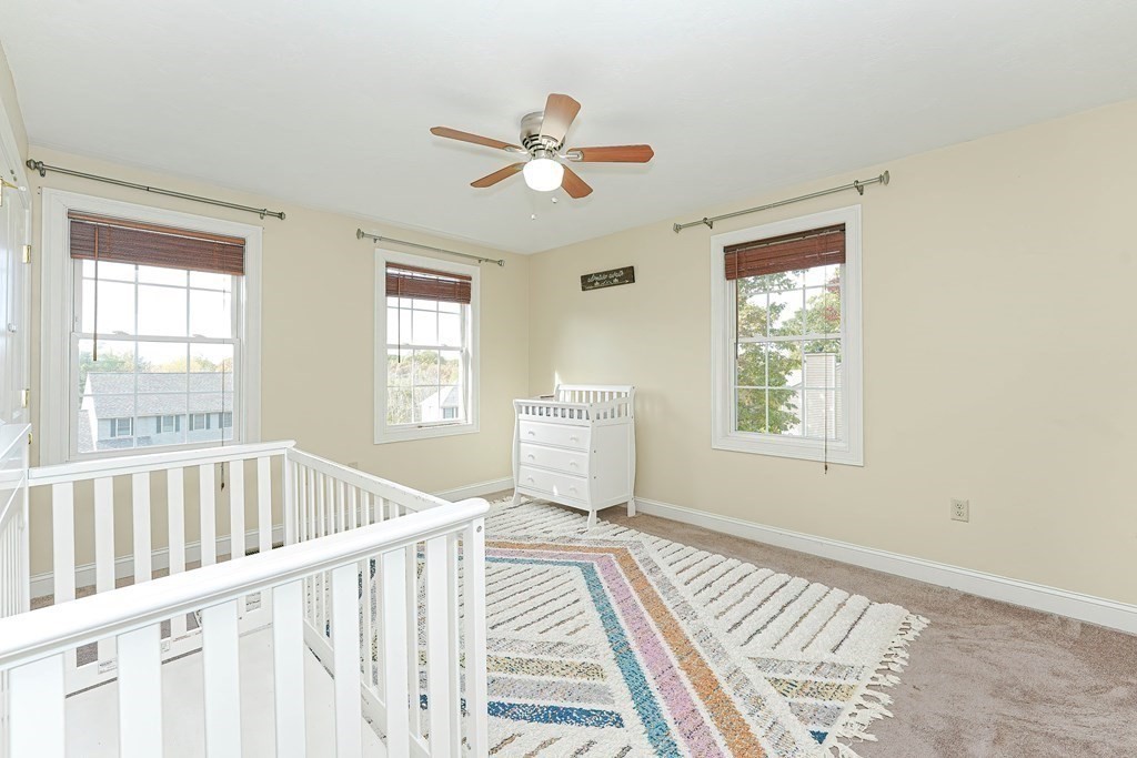 71 Snake Hill Road Ayer, MA 01432 - Photo 21 of 36 a view of a bedroom with wooden floor