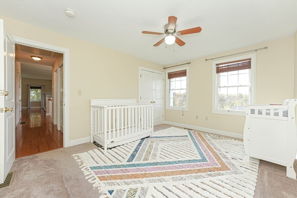 71 Snake Hill Road Ayer, MA 01432 - Photo 22 of 36 a living room with a bed furniture and a window
