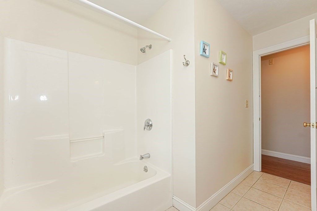71 Snake Hill Road Ayer, MA 01432 - Photo 24 of 36 a bathroom with a bathtub