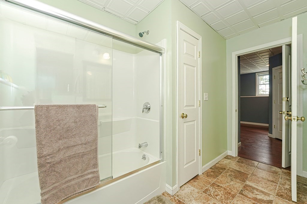 71 Snake Hill Road Ayer, MA 01432 - Photo 31 of 36 a bathroom with a glass shower door