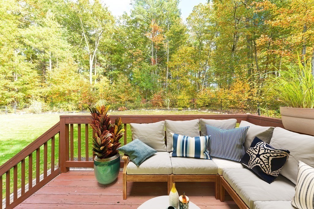 71 Snake Hill Road Ayer, MA 01432 - Photo 34 of 36 a balcony with furniture and wooden floor