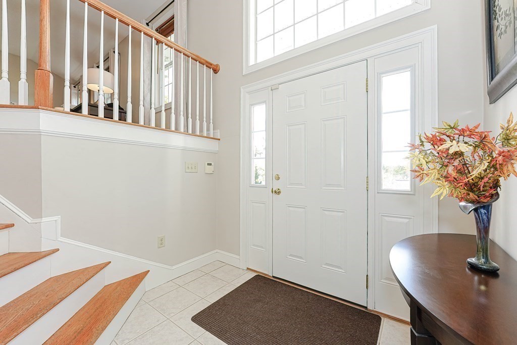 71 Snake Hill Road Ayer, MA 01432 - Photo 5 of 36 a view of a room that has a window and chair