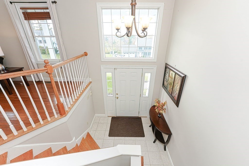 71 Snake Hill Road Ayer, MA 01432 - Photo 6 of 36 a view of staircase with wooden floor and windows