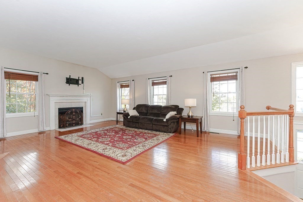 71 Snake Hill Road Ayer, MA 01432 - Photo 7 of 36 a living room with furniture and a fireplace