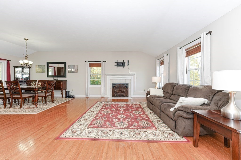 71 Snake Hill Road Ayer, MA 01432 - Photo 8 of 36 a living room with furniture and a fireplace
