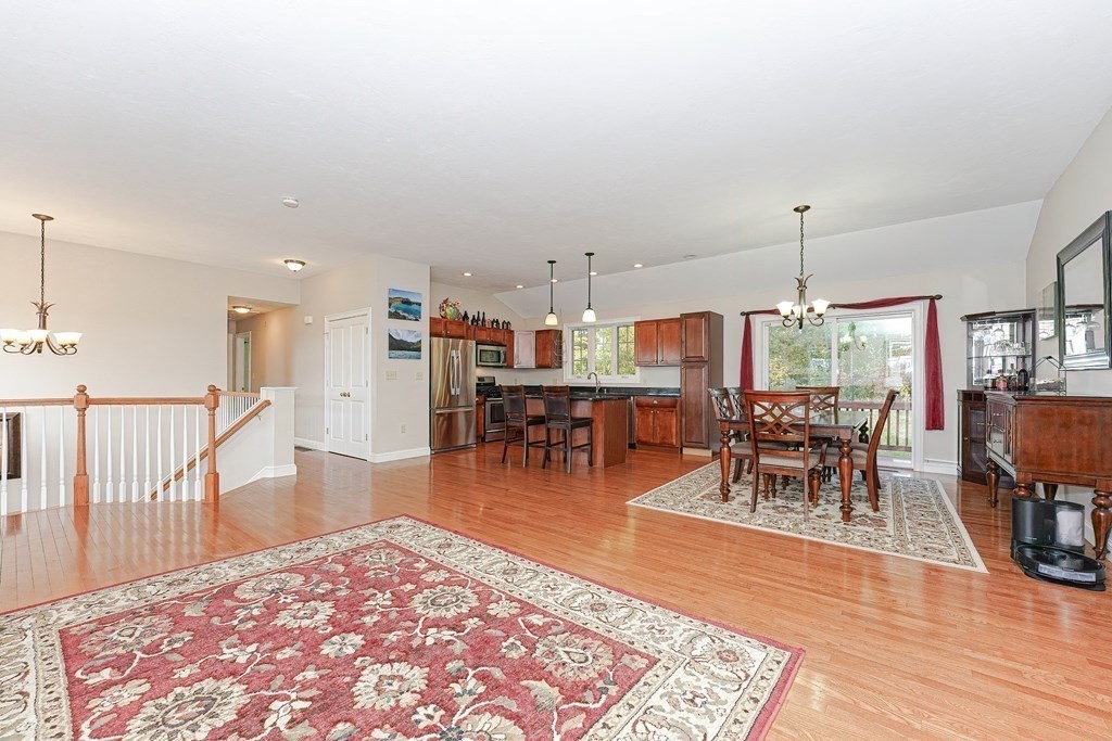 71 Snake Hill Road Ayer, MA 01432 - Photo 9 of 36 a living room with furniture a dining table and a rug