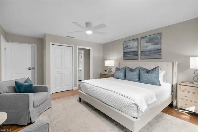 a spacious bedroom with a bed and a couch