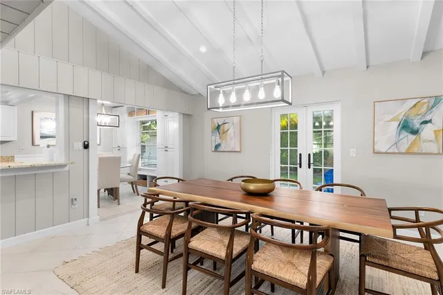 a view of a dining room with furniture and a table