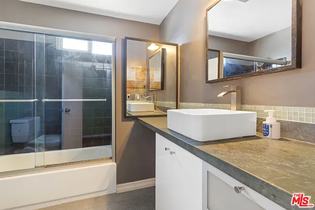 a bathroom with a sink and a bathtub