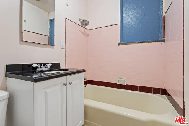 a bathroom with a sink and a bathtub