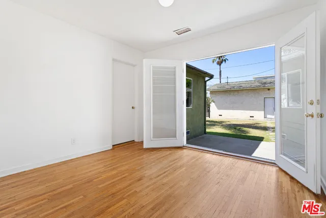 a view of hallway with wooden floor