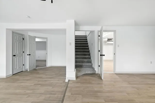 a bedroom with a bed and a potted plant