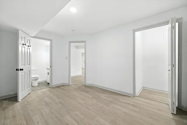 a living room with furniture and potted plant