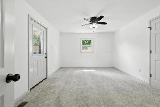 a view of backyard with green space