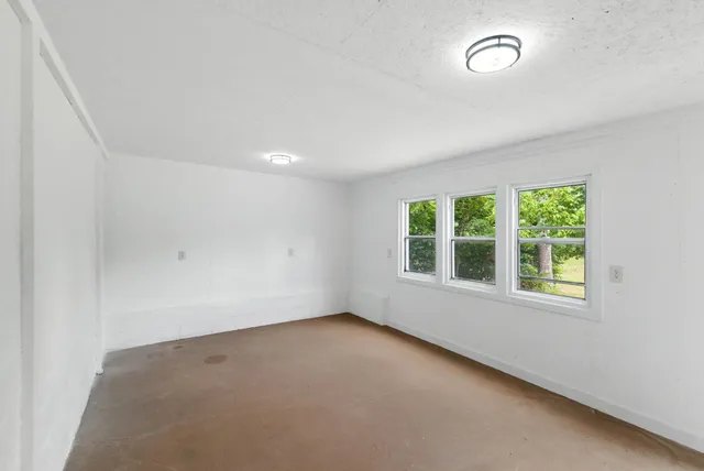 a view of a chair and table in the balcony