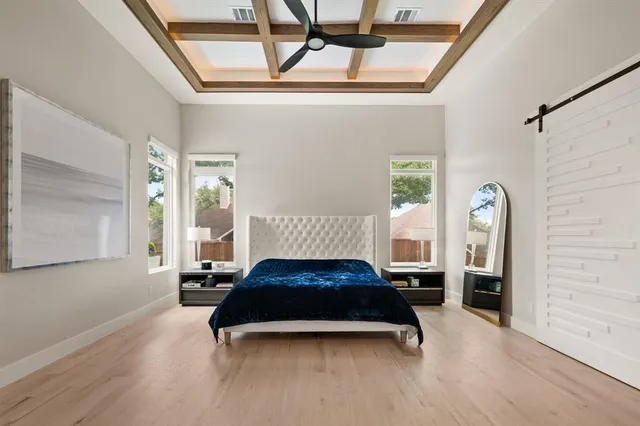 a living room with a bed furniture and a window