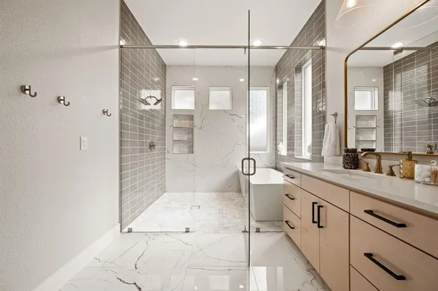 a large bathroom with a double vanity sink a mirror and a shower