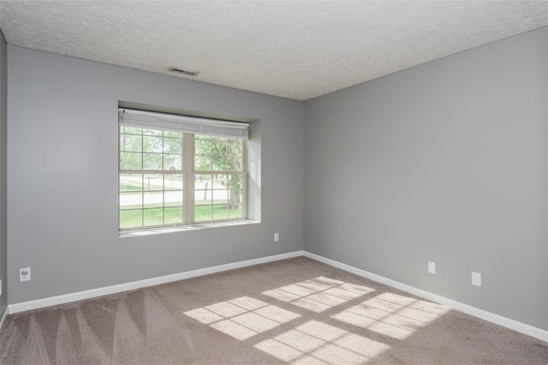 175 Marrett Farm Road Englewood, OH 45322 - Photo 23 of 29 Bright and airy room with ample natural light, featuring a window overlooking green surroundings.