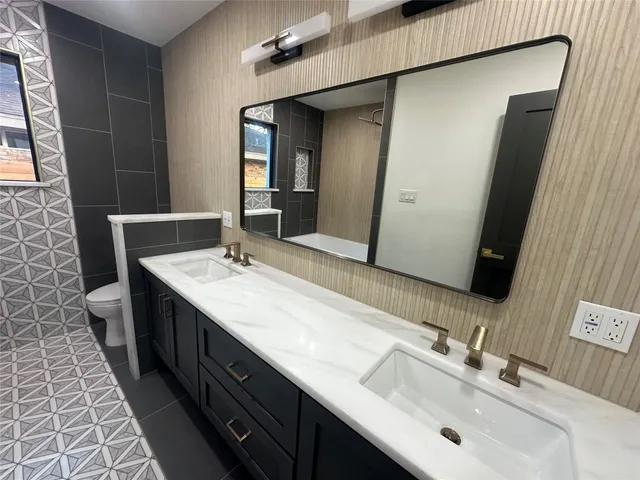 a bathroom with a bathtub and shower