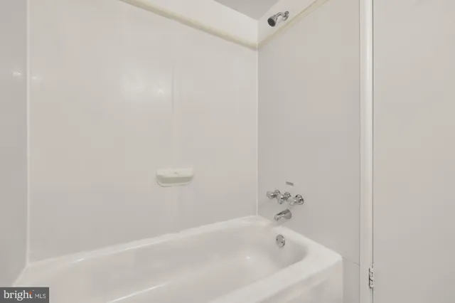 a white bath tub sitting in a bathroom
