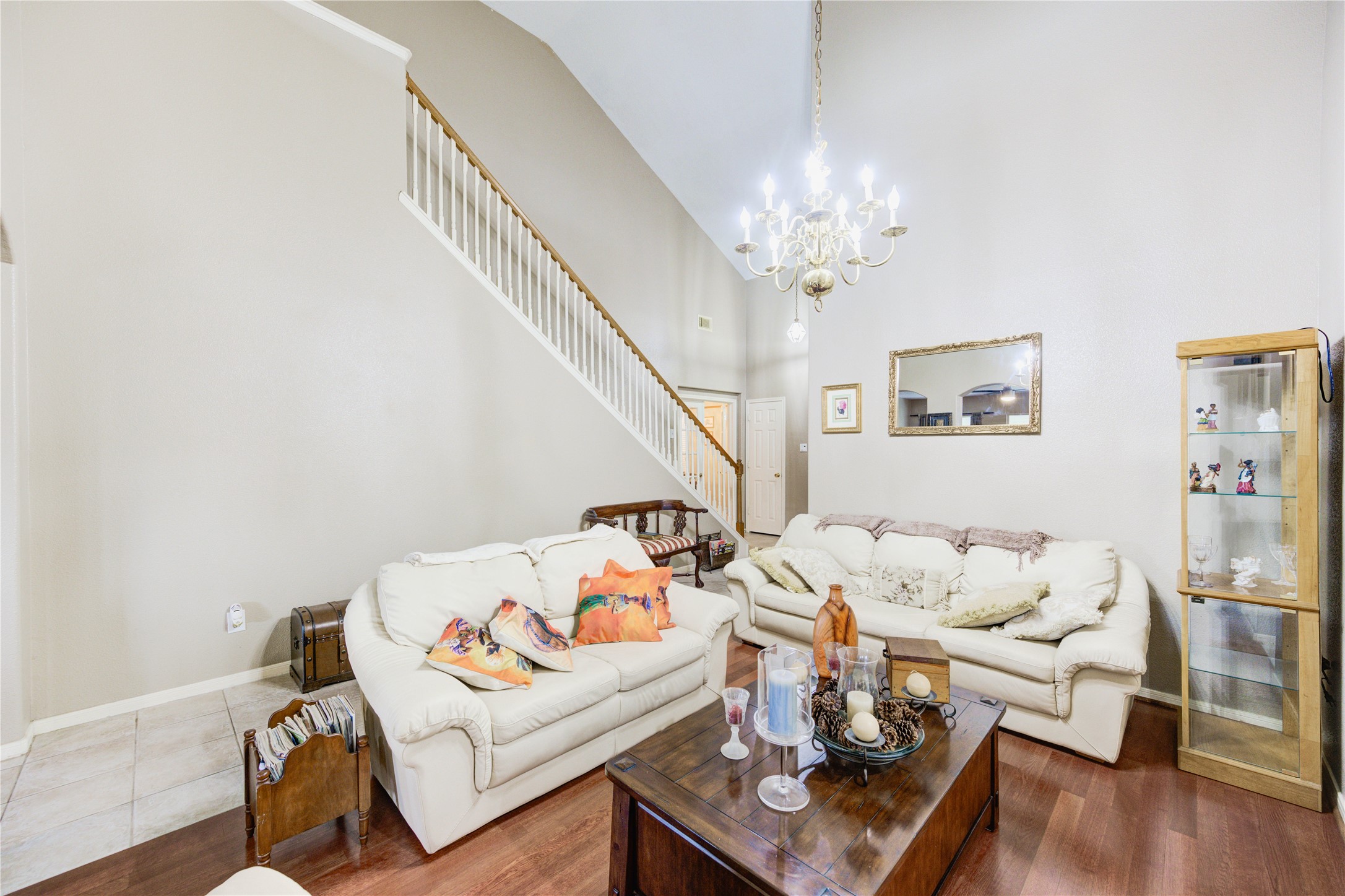 16730 Spring Barker Drive Cypress, TX 77429 - Photo 20 of 50 a living room with furniture and a chandelier