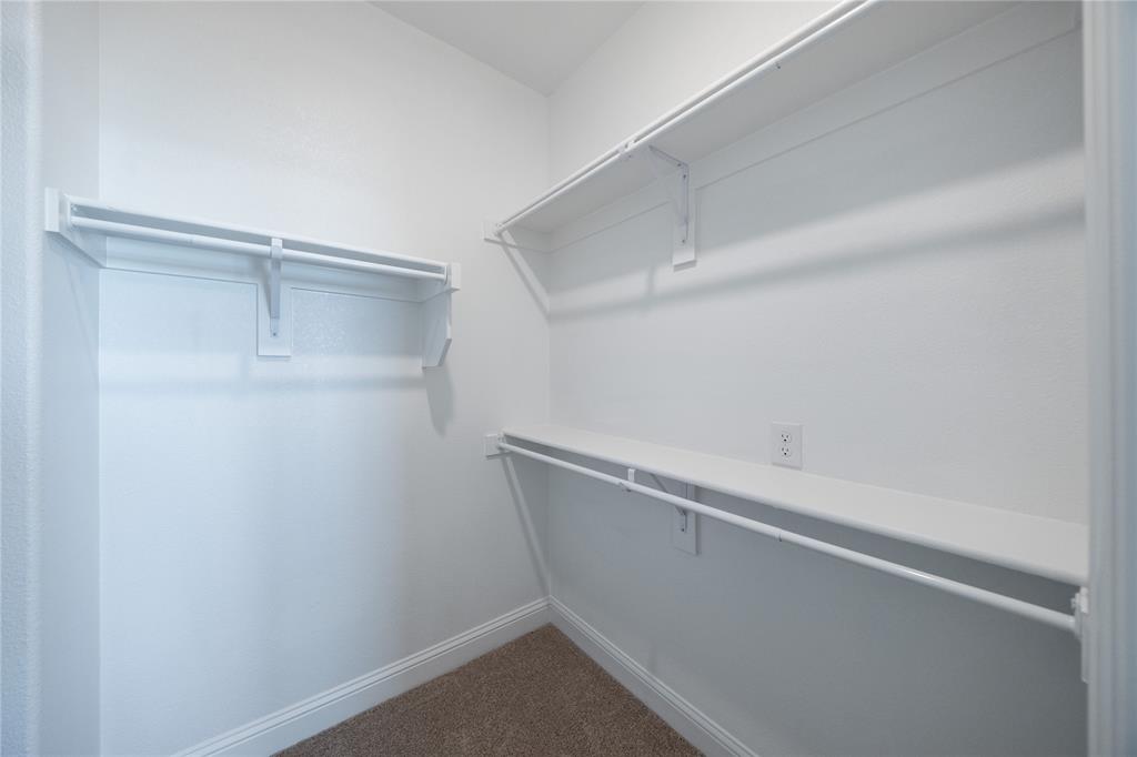 7929 Sunset Boulevard Rowlett, TX 75088 - Photo 11 of 32 a view of an empty walk in closet