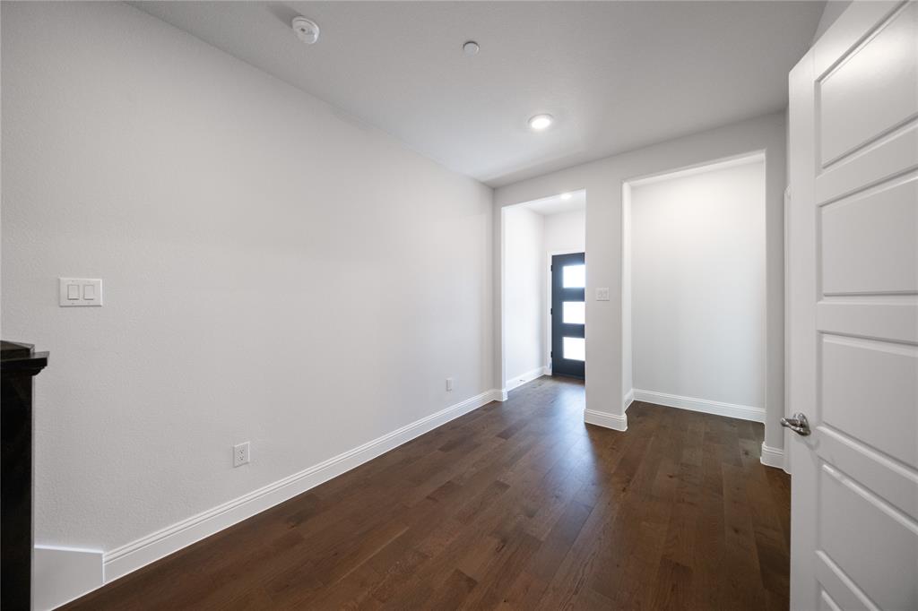 7929 Sunset Boulevard Rowlett, TX 75088 - Photo 12 of 32 a view of an empty room with wooden floor and closet