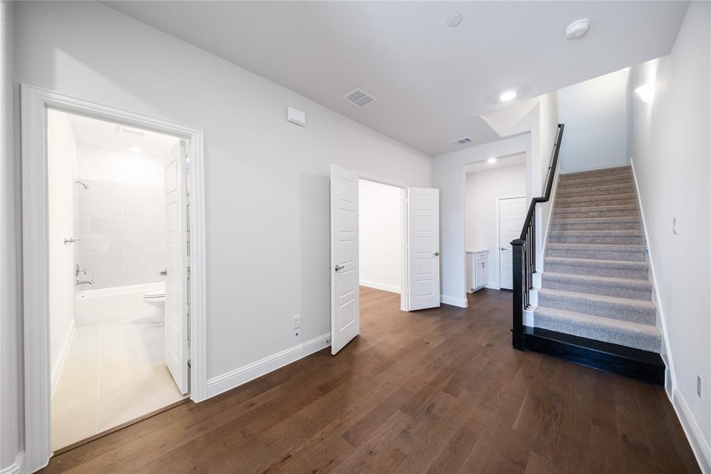 7929 Sunset Boulevard Rowlett, TX 75088 - Photo 13 of 32 a view of entryway with wooden floor