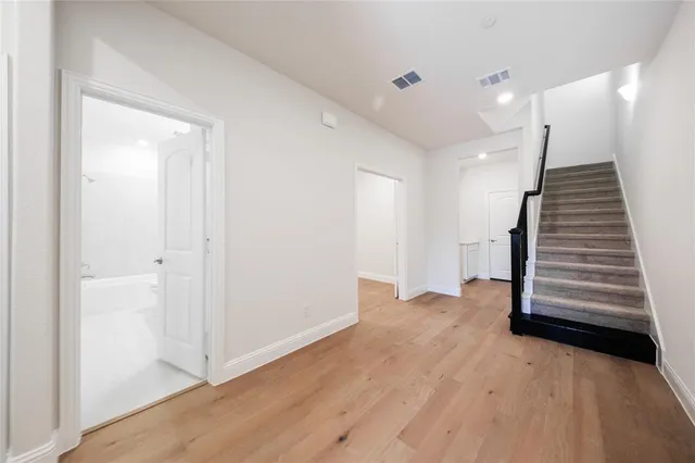 a view of entryway with wooden floor