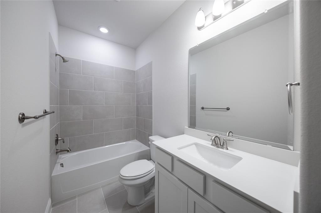 7929 Sunset Boulevard Rowlett, TX 75088 - Photo 19 of 32 a bathroom with a sink toilet and shower