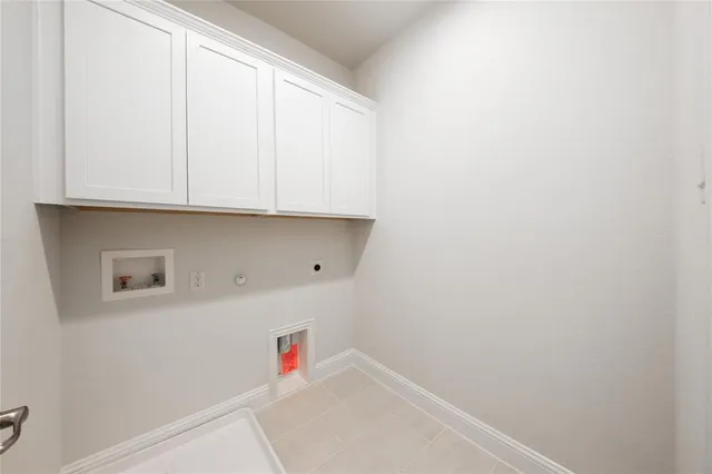 a view of storage and utility room with washer and dryer