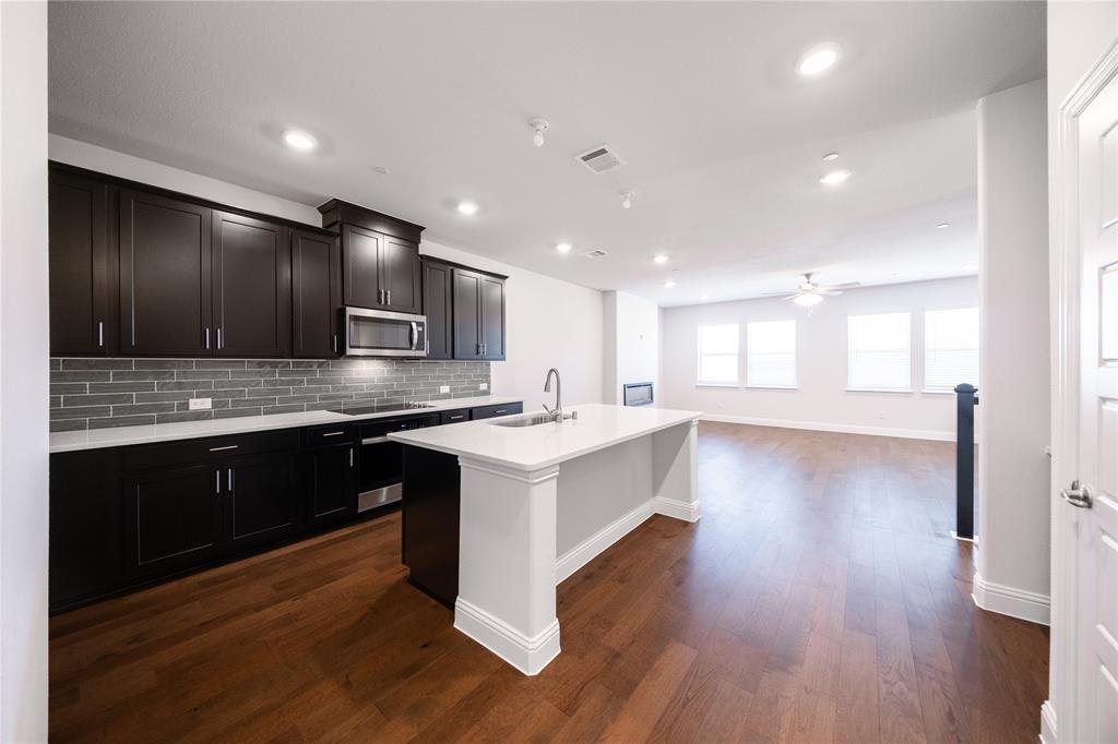 7929 Sunset Boulevard Rowlett, TX 75088 - Photo 2 of 32 a large kitchen with stainless steel appliances granite countertop a large counter top a sink and a stove